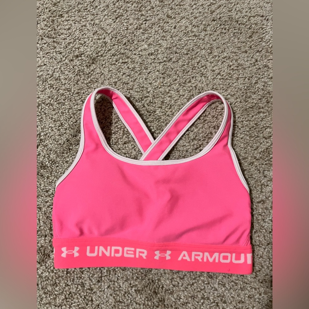 Pink and white Under Armour sports bra